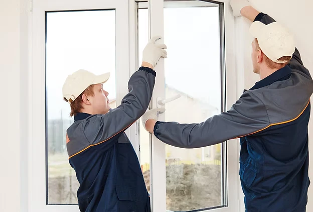 Workers installing window